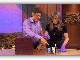 Jennifer Aniston puts on pink gloves for Dr. Oz's demonstration