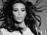 Kim Kardashian strikes a moody pose for Elle UK