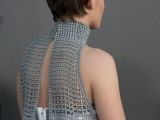 A view from the back of Kristen Stewart’s metallic mesh top, which added edge to her Chanel mini
