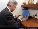 Clinton shown typing away space mails
