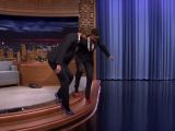 Fallon and Liam Hemsworth navigate their way down a couple of stairs in heels