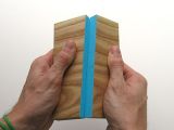 A smart block of wood elegantly breaking in half