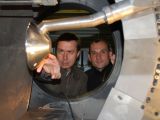 Two scientists working on the wind tunnel