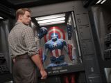 Captain Steve Rogers (Chris Evans) checks out his new Captain America suit