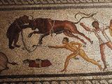 Roman mosaic: Bear-bull fight with a bestiarius