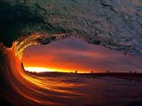 Daredevil surfer captures amazing shots from inside waves