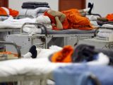 Prisoners sleep in the gymnasium at the Richard J. Donovan Correctional Facility in San Diego