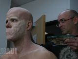 Ryan Reynolds sits in the makeup chair to have prosthetics applied on his face
