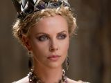 Charlize Theron plays the Evil Queen with relish, in a very over the top but delicious manner