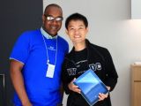 Apple Genius is not only happy to hook up Stone with a new iPad, but he also agrees to take a picture with him