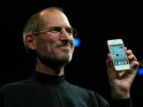 Jobs showing off an iPhone