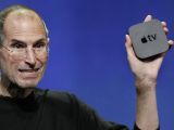 Steve Jobs holding Apple TV