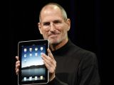 Steve Jobs holding the iPad