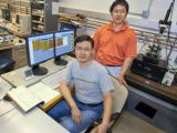 Junqiao Wu (sitting) led a team that included Jinbo Cao (standing), which demonstrated that phase inhomogeneity in correlated electron materials could be created through the application of external strain