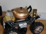 The teapots all rest atop radio-controlled cars