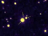 A false-color image from the W. M. Keck Observatory in Hawaii shows the first observed triple quasara trio of enormous, hyperactive black holes in close proximity to each other.