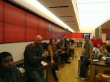 People waiting in line in a Microsoft Store to test their phones against a Windows Phone