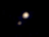 Lo and behold, the first ever color image of Pluto