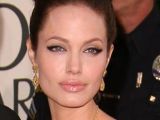 Angelina Jolie goes for subtle bat-wings