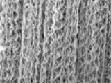 A mat of nanocoils. Scale bar = 2 micrometers