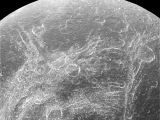 Dione carries craters and fractures too