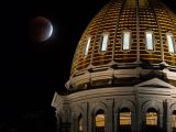 Supermoon lunar eclipse behind the Colorado State Capitol Building