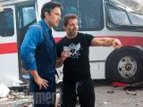 Director Zack Snyder gives tips to Ben Affleck, in character as Bruce Wayne