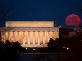 Supermoon is seen as it rises near the Lincoln Memorial on March 19, 2011