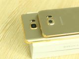 Samsung Galaxy Note5 and S6 edge+ in gold, on top of each other