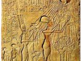 Queen Nefertiti and her family praying to the god Aten